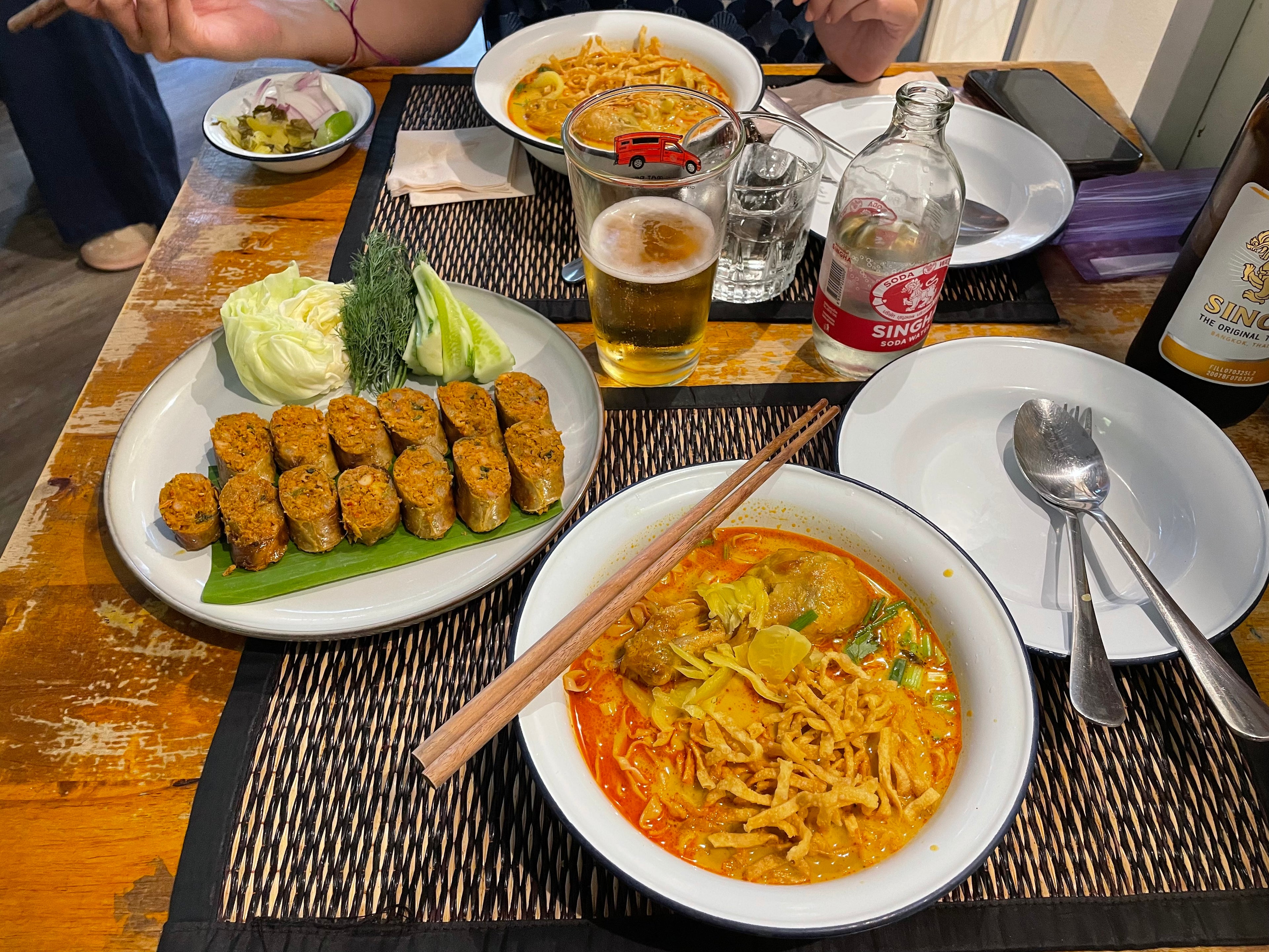 Traditional Northern Thai food on table with drinks